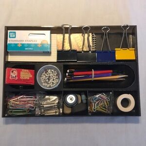 Black plastic tray and office supplies